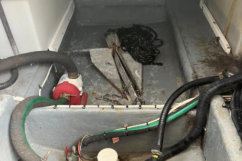 Slide: The Image of Bilge area of a 2000 Baha Cruisers 272 Sportfish with anchor and hoses. - 38