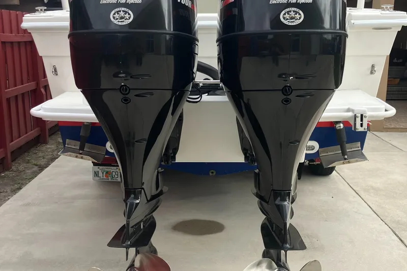 Slide: The Image of 2000 Baha Cruisers 272 Sportfish with twin outboard motors, rear view. - 11
