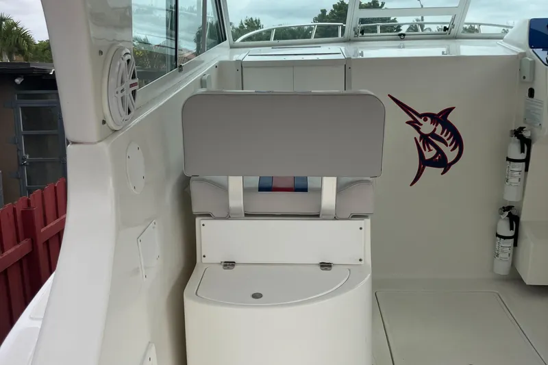 Slide: The Image of 2000 Baha Cruisers 272 Sportfish interior with seating and marlin graphic. - 31