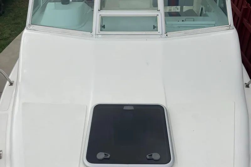 Slide: The Image of 2000 Baha Cruisers 272 Sportfish boat deck with windshield and hatch. - 15