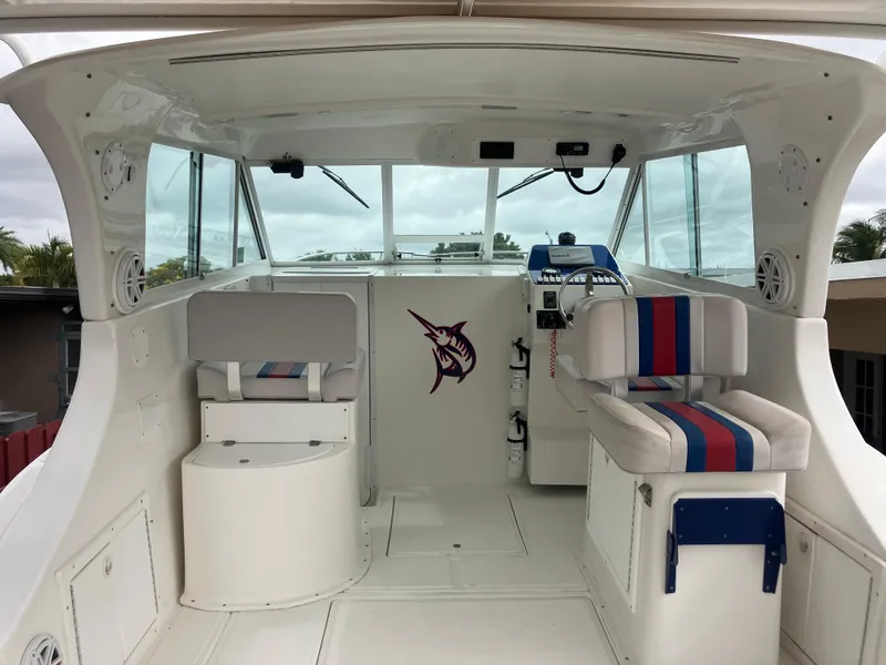 Slide: The Image of 2000 Baha Cruisers 272 Sportfish boat interior with helm and seating. - 6
