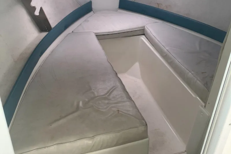 Slide: The Image of Interior cabin of a 2000 Baha Cruisers 272 Sportfish boat with cushioned seating. - 34
