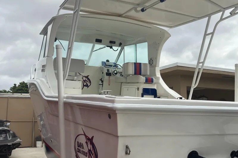 Slide: The Image of 2000 Baha Cruisers 272 Sportfish boat with covered cockpit and seating. - 4