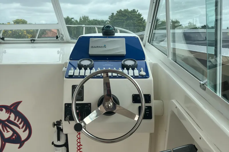 Slide: The Image of Baha Cruisers 272 Sportfish 2000 boat helm with Garmin navigation system. - 17