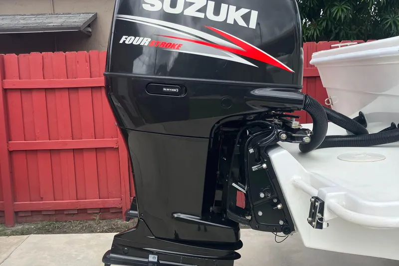 Slide: The Image of Suzuki Four Stroke outboard motor on 2000 Baha Cruisers 272 Sportfish boat. - 24