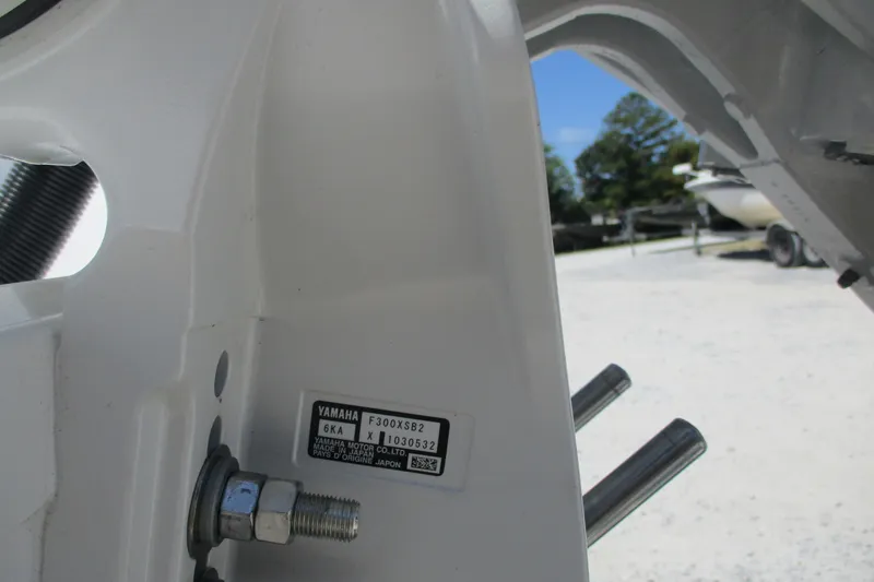 Slide: The Image of Close-up of a 2027 Sportsman Open 232 Center Console boat component with Yamaha label. - 16