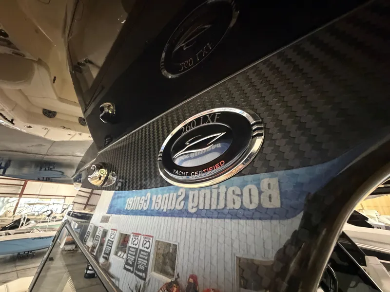 Slide: The Image of Close-up of Scout 260 LXF with yacht certification, reflected in a showroom window. - 17