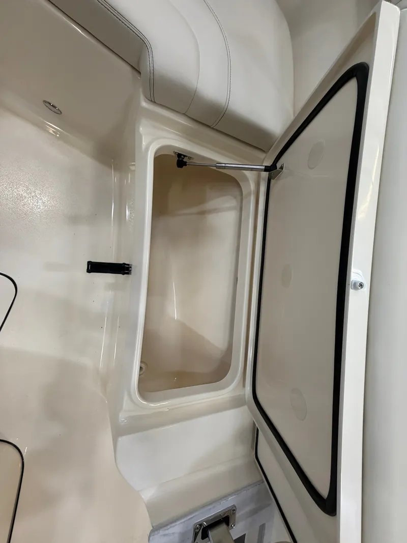 Slide: The Image of Interior view of a storage compartment on a 2027 Scout 260 LXF boat. - 33