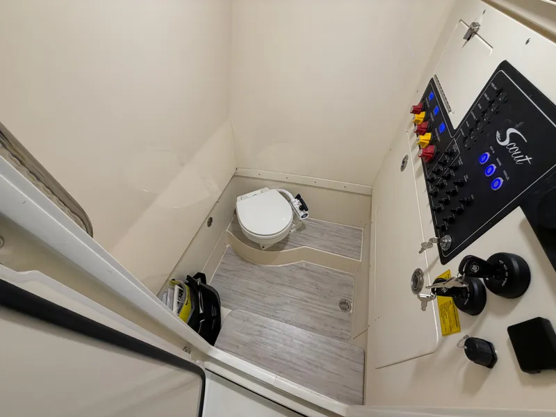 Slide: The Image of Interior view of a boat with a toilet and control panel, modern design, light-colored walls. - 36