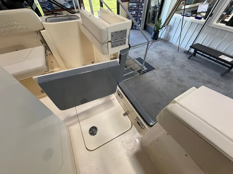 Slide: The Image of Interior view of a 2027 Scout 260 LXF boat with seating and storage areas. - 35