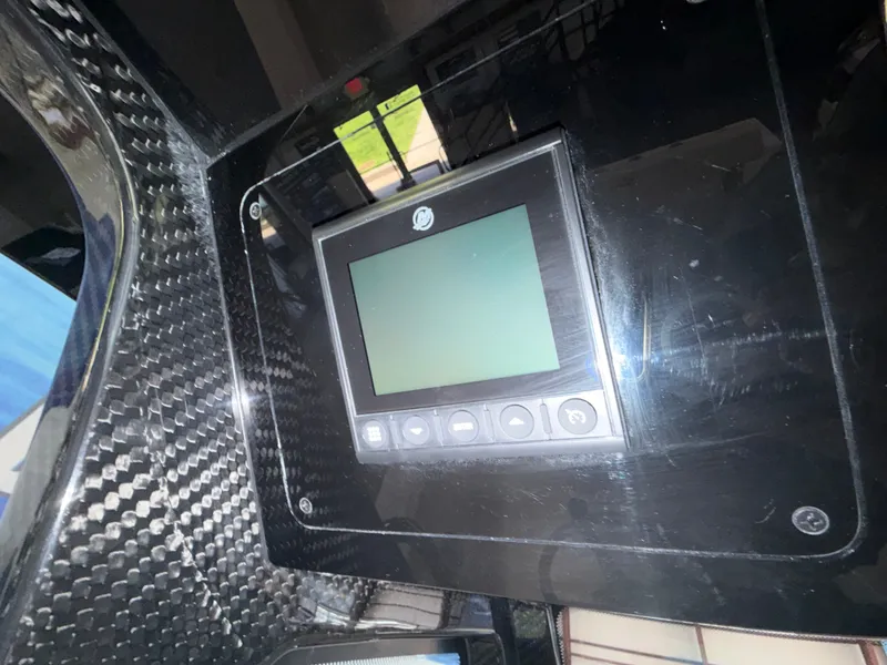 Slide: The Image of A modern control panel with a digital screen in a Scout 260 LXF boat. - 28