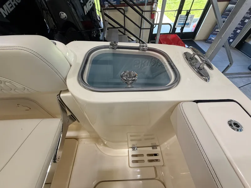 Slide: The Image of The image shows the cockpit of a 2027 Scout 260 LXF boat with a built-in sink. - 47