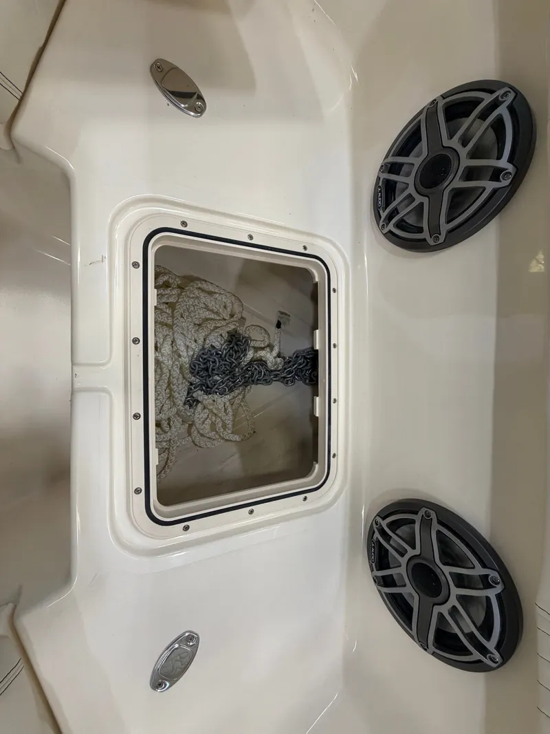 Slide: The Image of The image shows the anchor locker of a Scout 260 LXF boat with ropes and speakers. - 21