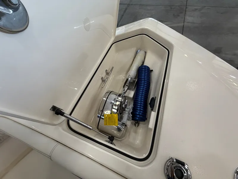 Slide: The Image of A storage compartment on a Scout 260 LXF boat with anchor and rope. - 24