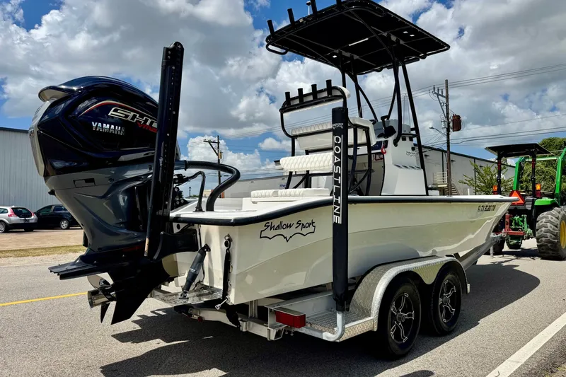 Slide: The Image of 2025 Shallow Sport 24 Modified V boat with Yamaha engine on trailer. - 4