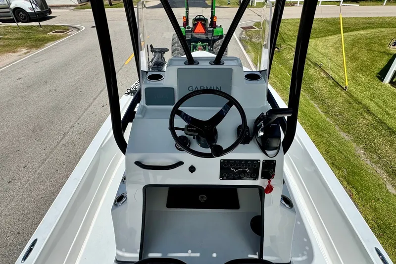 Slide: The Image of 2025 Shallow Sport 24 Modified V boat console with Garmin navigation system. - 10