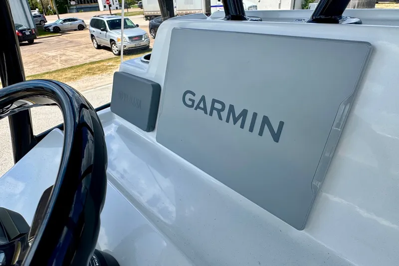 Slide: The Image of Console of 2025 Shallow Sport 24 Modified V with Garmin and Yamaha displays. - 16