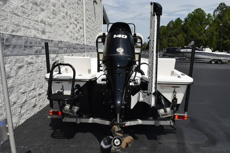 Slide: The Image of Blazer Bay 2020 boat, rear view with 140 HP engine, parked outdoors. - 5