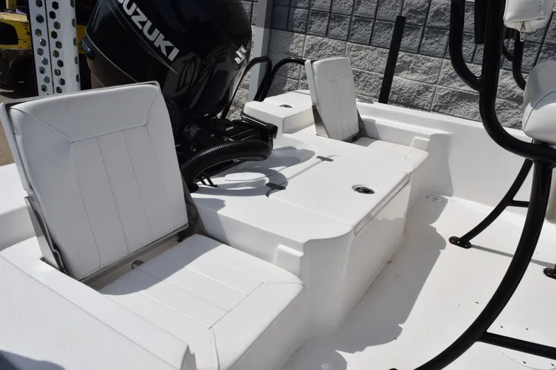 Slide: The Image of Interior of 2023 Blazer Bay 2020 boat with Suzuki engine, featuring white seating and storage. - 10