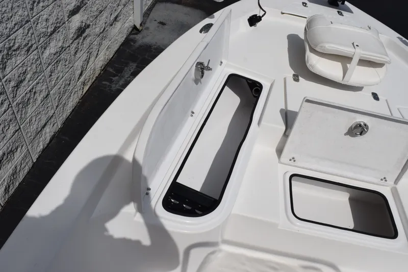 Slide: The Image of Open storage compartments on a 2023 Blazer Bay 2020 boat deck. - 18