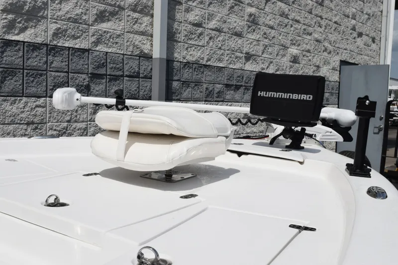 Slide: The Image of Blazer Bay 2020 boat with Humminbird equipment, 2023 model, docked near a brick wall. - 7