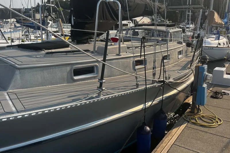 Slide: The Image of Sleek 2005 Brewer Cutter yacht docked at marina with modern design. - 27