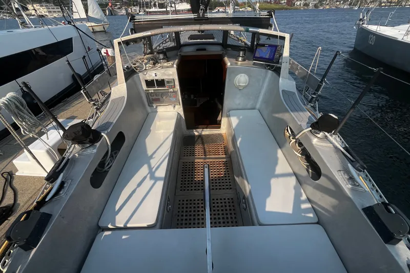 Slide: The Image of 2005 Brewer Cutter sailboat cockpit with seating and navigation equipment. - 58