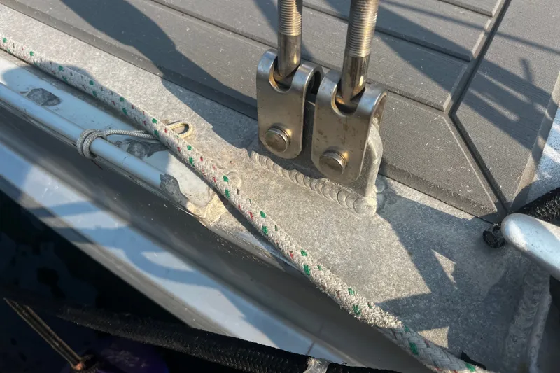 Slide: The Image of Close-up of a 2005 Brewer Cutter sailboat deck hardware and rigging details. - 46