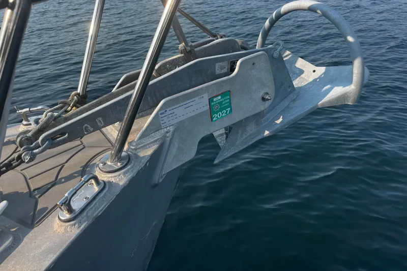 Slide: The Image of Bow of a 2005 Brewer Cutter boat with anchor over water. - 29