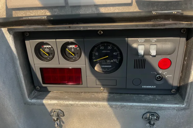 Slide: The Image of Control panel of a 2005 Brewer Cutter with Yanmar engine gauges and switches. - 61