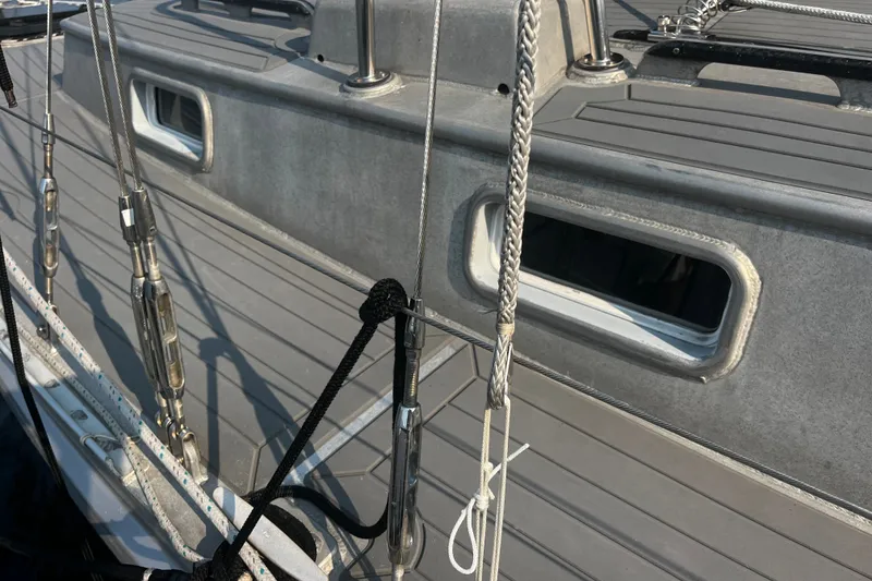 Slide: The Image of Sailboat deck with rigging, featuring a Brewer Cutter, 2005 model. - 33