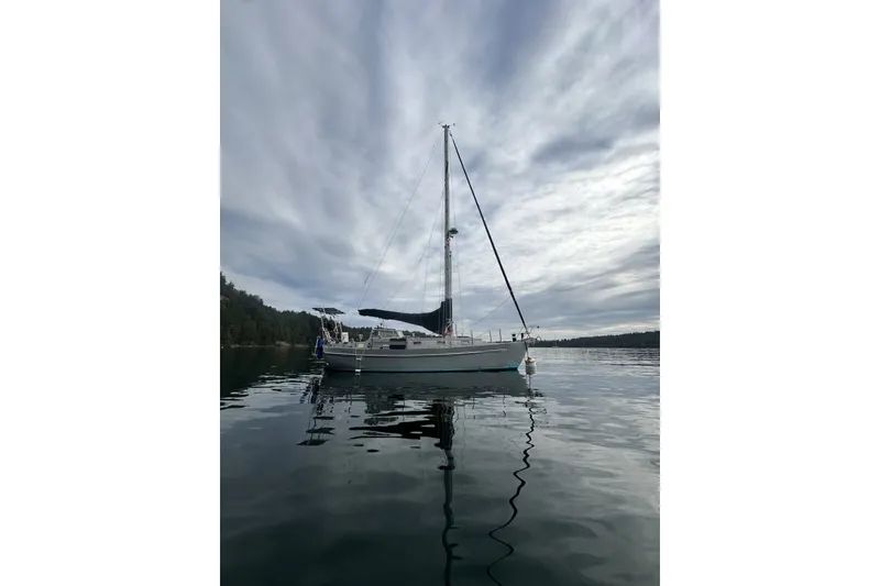 Slide: The Image of Sailboat on calm water, Brewer Cutter 2005, under cloudy sky. - 63