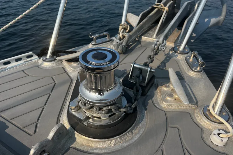 Slide: The Image of Bow of 2005 Brewer Cutter sailboat with anchor windlass and chain. - 37
