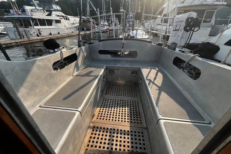 Slide: The Image of Spacious cockpit of a 2005 Brewer Cutter yacht docked at a marina. - 54