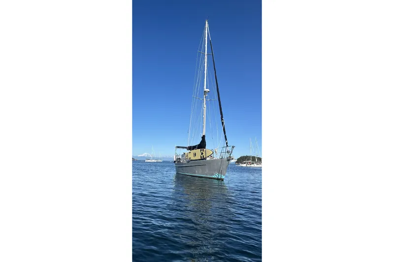 Slide: The Image of Sailboat on calm water, Brewer Cutter 2005, under clear blue sky. - 62