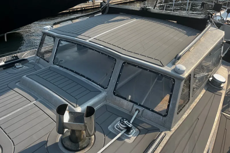 Slide: The Image of 2005 Brewer Cutter boat with sleek design and modern features docked at marina. - 50