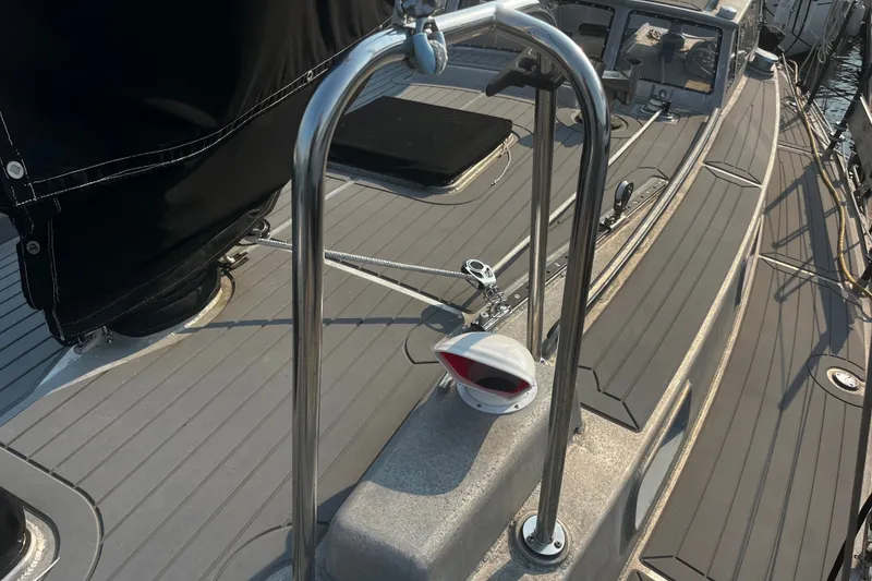 Slide: The Image of Deck of 2005 Brewer Cutter sailboat with stainless steel railings and equipment. - 45