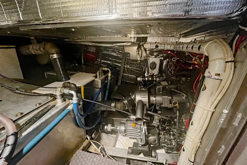 Slide: The Image of Engine room of a 2005 Brewer Cutter, showcasing mechanical components and wiring. - 16