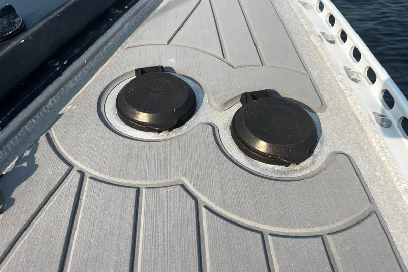 Slide: The Image of Deck of 2005 Brewer Cutter boat with two black circular fittings. - 38
