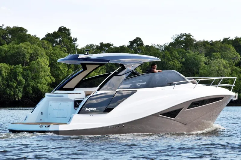 Slide: The Image of Manufacturer Provided Image: 2025 NX Boats 360 Sport Coupe cruising on a serene waterway. - 3