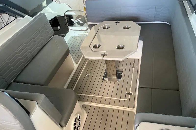 Slide: The Image of 2026 NX Boats 360 Sport Coupe interior with seating and table setup. - 19