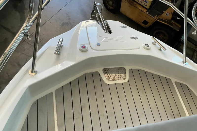 Slide: The Image of Bow of 2026 NX Boats 360 Sport Coupe with sleek design and stainless steel fittings. - 25