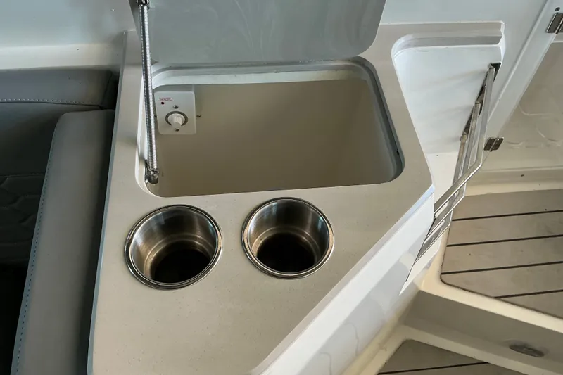 Slide: The Image of Compact sink and cup holders on 2026 NX Boats 360 Sport Coupe. - 22
