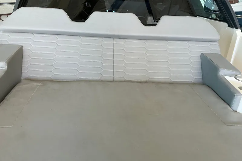 Slide: The Image of Interior seating of 2026 NX Boats 360 Sport Coupe, featuring modern upholstery design. - 26