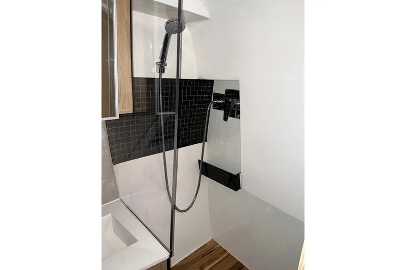 Slide: The Image of Modern shower area in 2026 NX Boats 360 Sport Coupe, featuring sleek design and fixtures. - 36