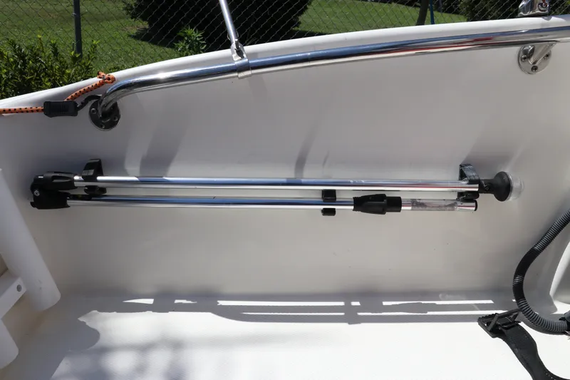 Slide: The Image of 2017 Boston Whaler 130 Super Sport interior with mounted chrome railings. - 10