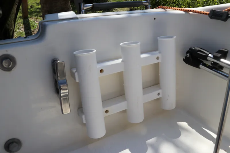 Slide: The Image of Rod holders on a 2017 Boston Whaler 130 Super Sport boat interior. - 9