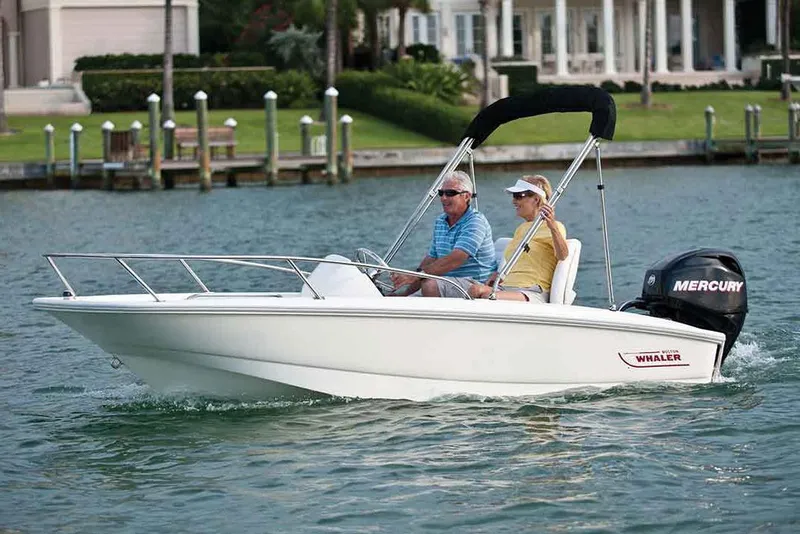 Slide: The Image of Manufacturer Provided Image: 2017 Boston Whaler 130 Super Sport boat cruising on water with two passengers. - 26