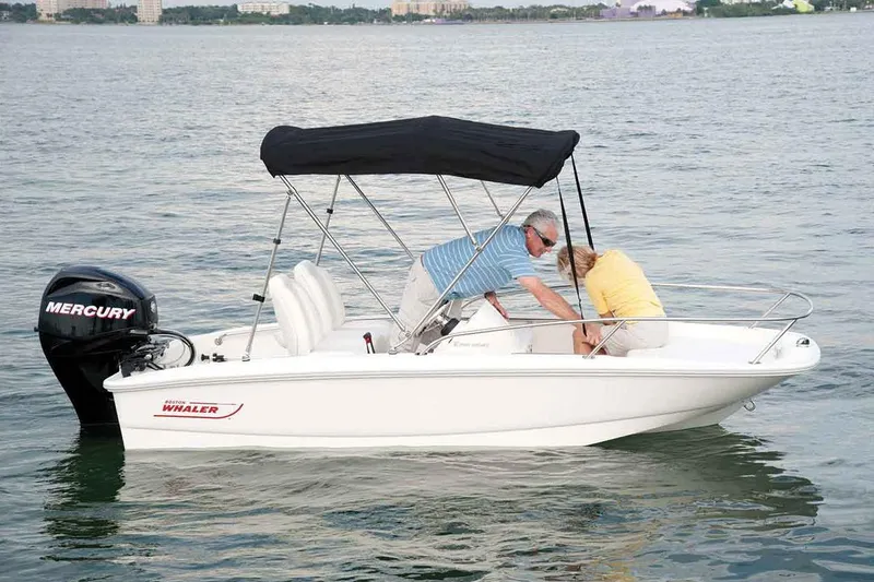 Slide: The Image of Manufacturer Provided Image: 2017 Boston Whaler 130 Super Sport boat on water with two people. - 25