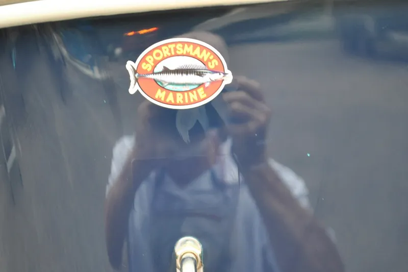 Slide: The Image of Sticker on 2016 Regulator 28 Forward Seating boat, featuring "Sportsman's Marine" logo. - 45